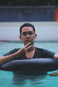 Portrait of young man in swimming pool