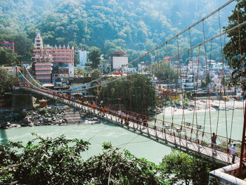 High angle view of trees and buildings in city