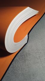 High angle view of paper on table against wall