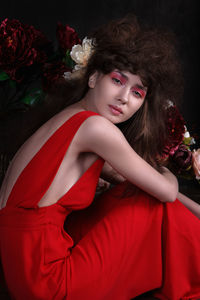 Young woman in red flower