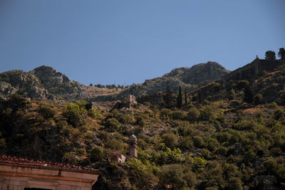 Scenic view of mountains against clear blue sky