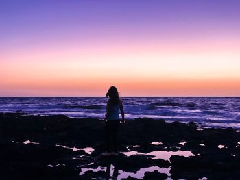 Man on beach during sunset