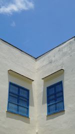 Low angle view of building against blue sky