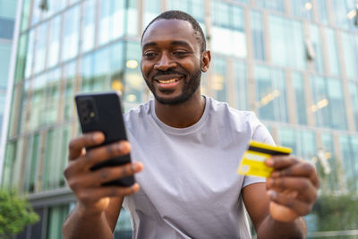 Young man using mobile phone