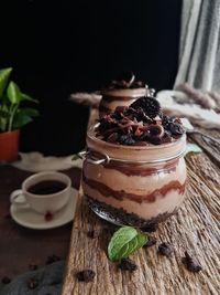 Close-up of dessert in jar on table