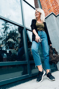 Full length portrait of woman smiling