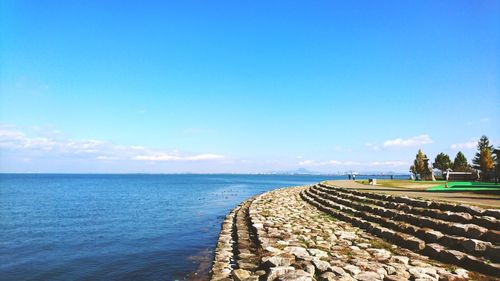 Scenic view of sea against blue sky