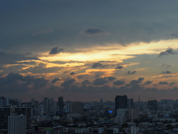 Cityscape against sky during sunset