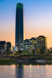 Santiago de chile - pond at bicentennial park in the wealthy vitacura district and skyline.