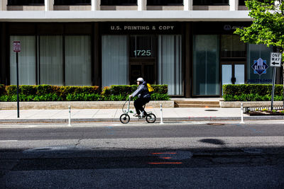 Man riding bicycle on road