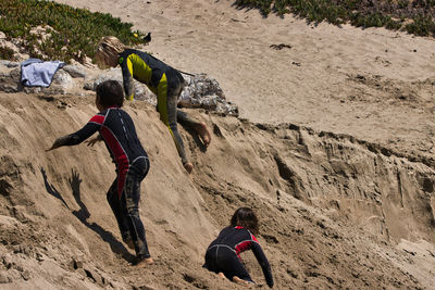 Rear view of people on rock