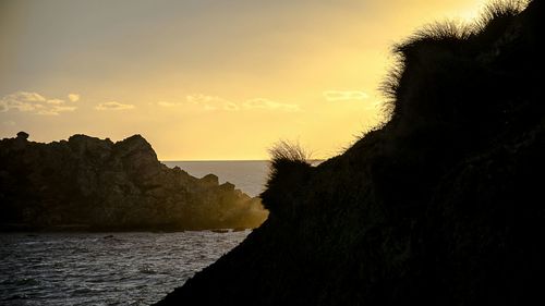 Scenic view of sea at sunset