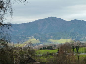 Scenic view of landscape and mountains against sky