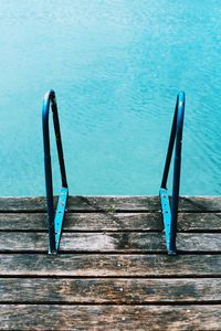 Close-up of wood against blue water