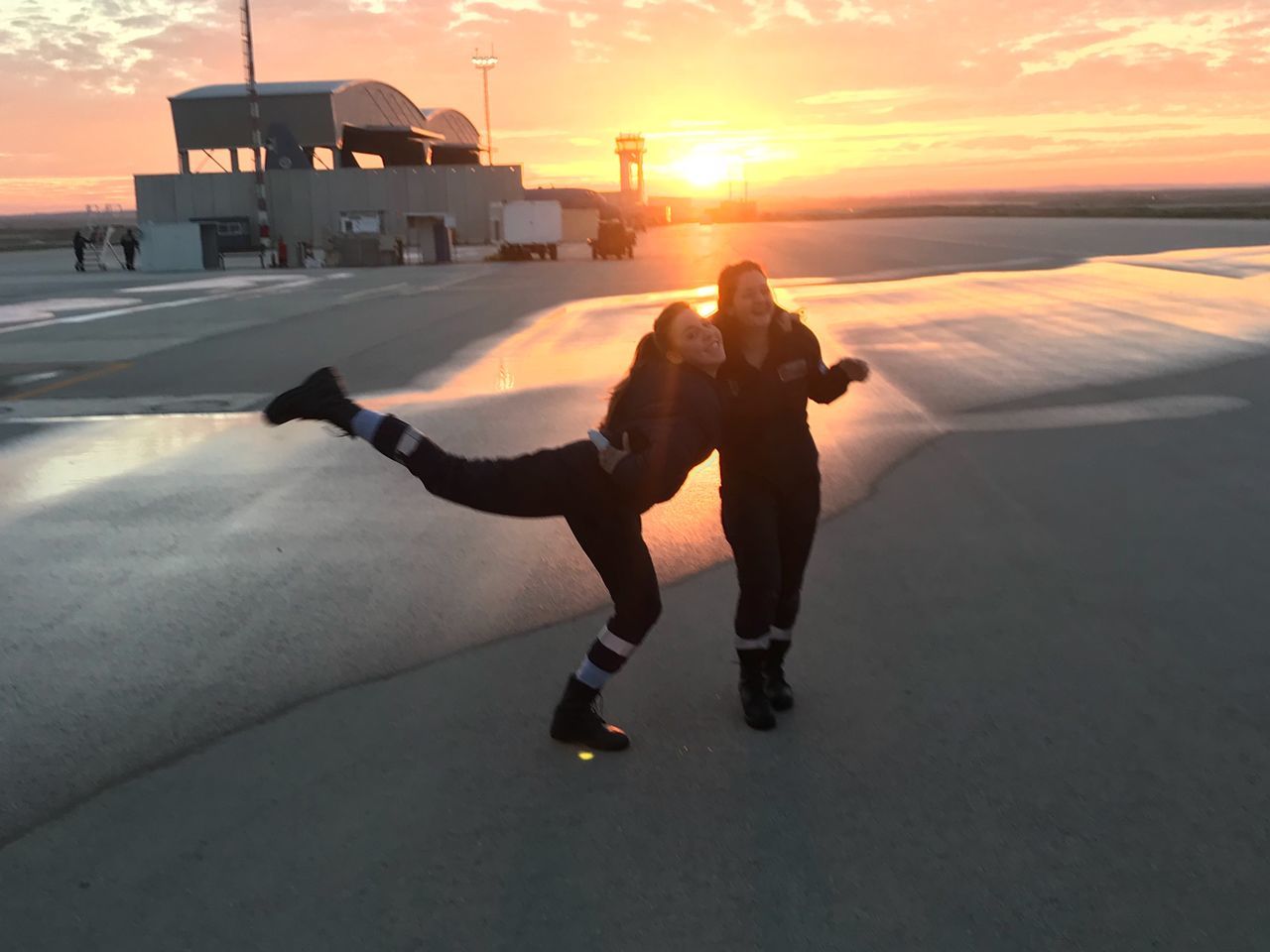 sunset, sky, real people, cold temperature, nature, full length, leisure activity, outdoors, water, winter, sun, sea, lifestyles, silhouette, cloud - sky, scenics, beauty in nature, ice-skating, architecture, one person, ice skate, built structure, building exterior, men, ice rink, day, people