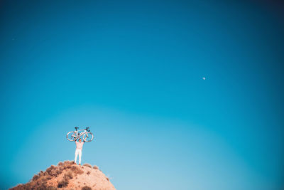 Low angle view of windmill against clear sky