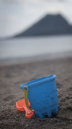 Close-up of toy on beach