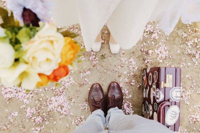 Low section of person standing on tiled floor