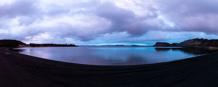 Panoramic view of sea against storm clouds