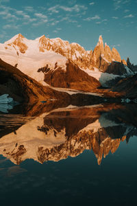 Scenic view of lake and rock mountains