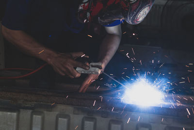 Welder, welding automotive part in a car factory