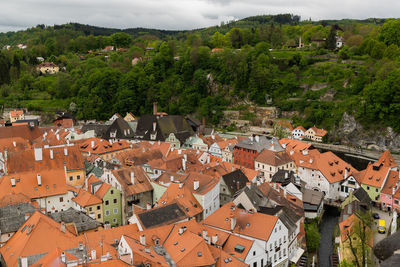 High angle view of houses and trees in town