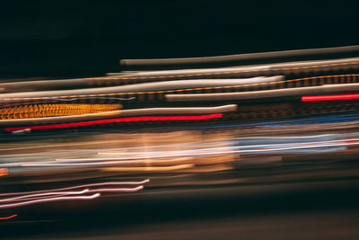 Light trails on road in city at night