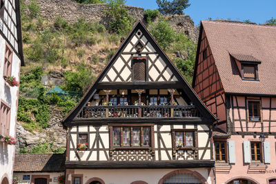 Small colorful german half timbered houses in kaysersberg along the main street.