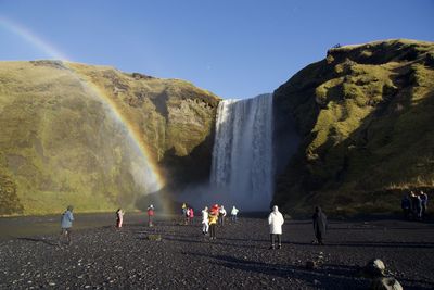 People against waterfall