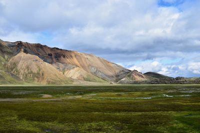 Scenic view of landscape and mountains against sky