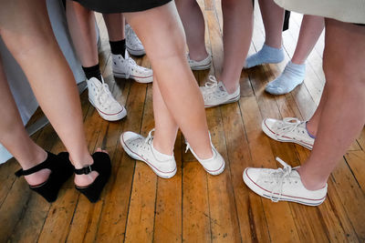 Low section of people standing on floor