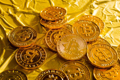 Close-up of bitcoins on golden paper