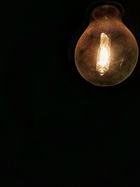 Low angle view of lit lamp