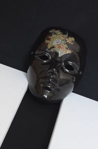 High angle view of human face on table