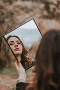 Portrait of woman looking at camera