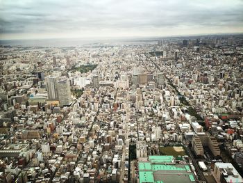 Aerial view of cityscape against sky