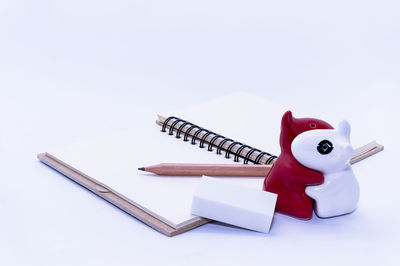 High angle view of stuffed toy against white background