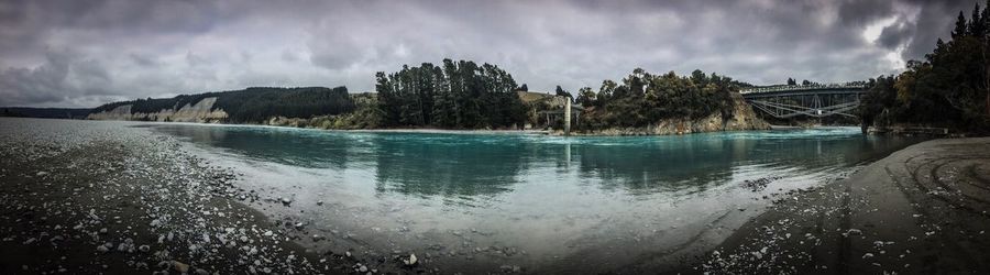 Panoramic view of sea against storm clouds