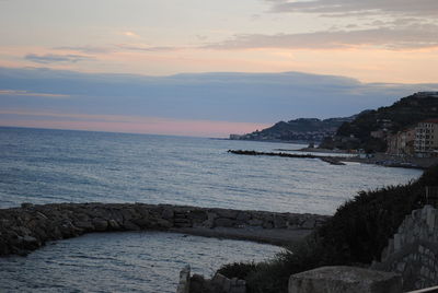 Scenic view of sea against sky at sunset