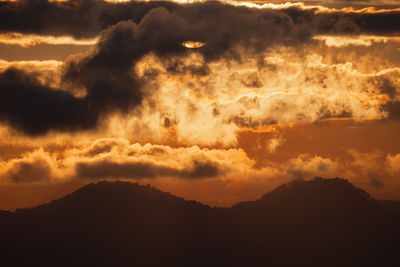 Low angle view of dramatic sky during sunset