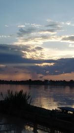 Scenic view of lake at sunset