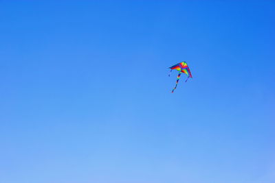 Low angle view of kite flying in sky