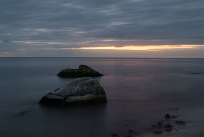 Scenic view of sea against sky at sunset