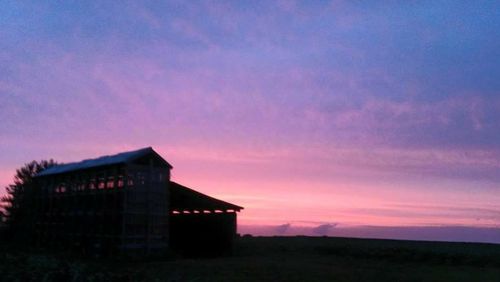 Built structure against sky at sunset