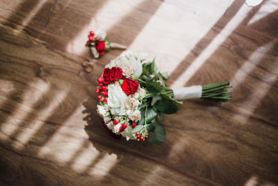 High angle view of flowers on wooden table