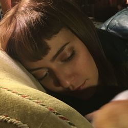 Close-up portrait of a young woman sleeping