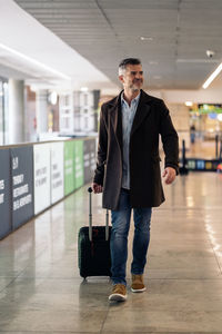 Full length of man standing at airport