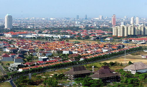 High angle view of buildings in city against sky