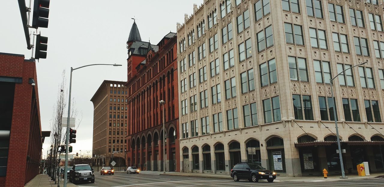 VIEW OF CITY STREET BY BUILDINGS