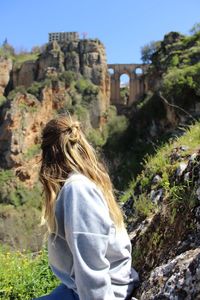 Rear view of woman against sky